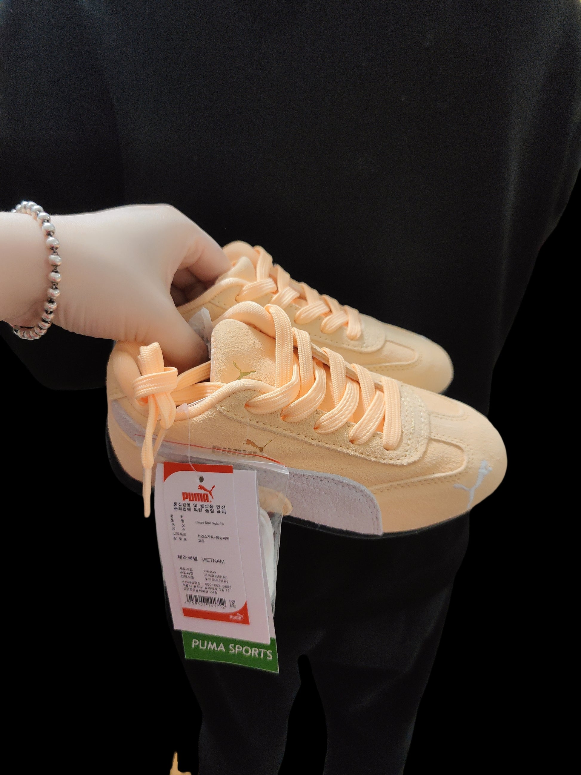 Puma racing shoes 🏎️🏎️🏎️🏎️🏎️" A light, peachy orange"