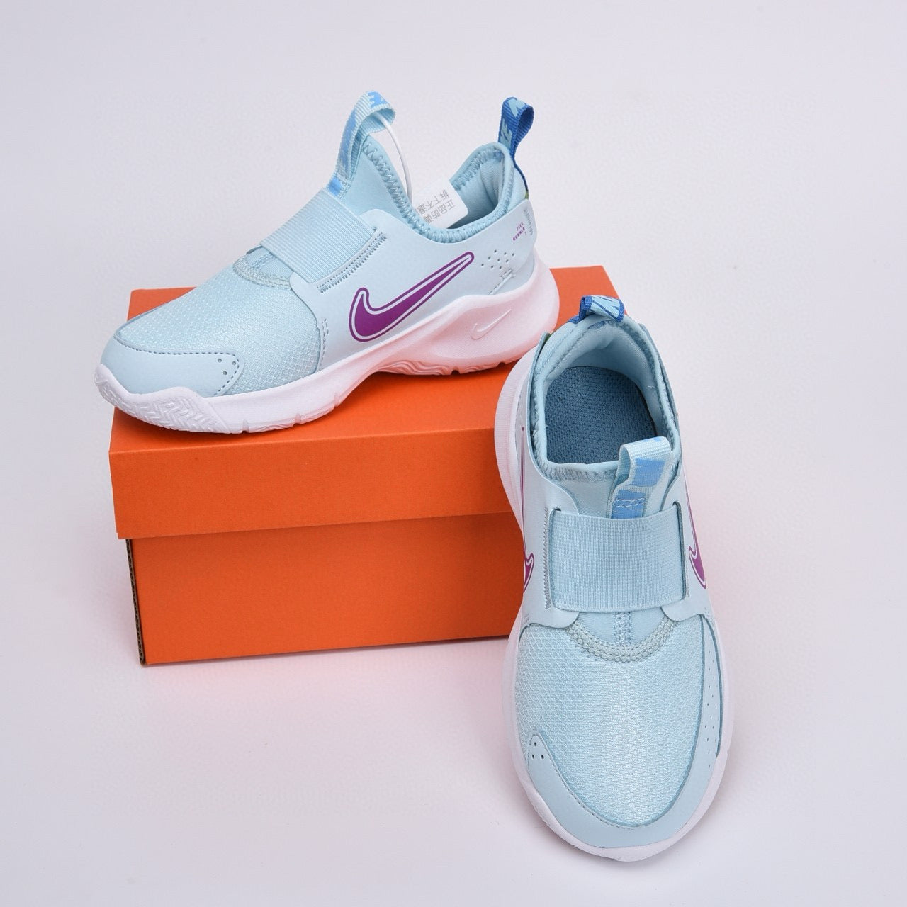 Nike slip-on running shoes" sky blue, purple"