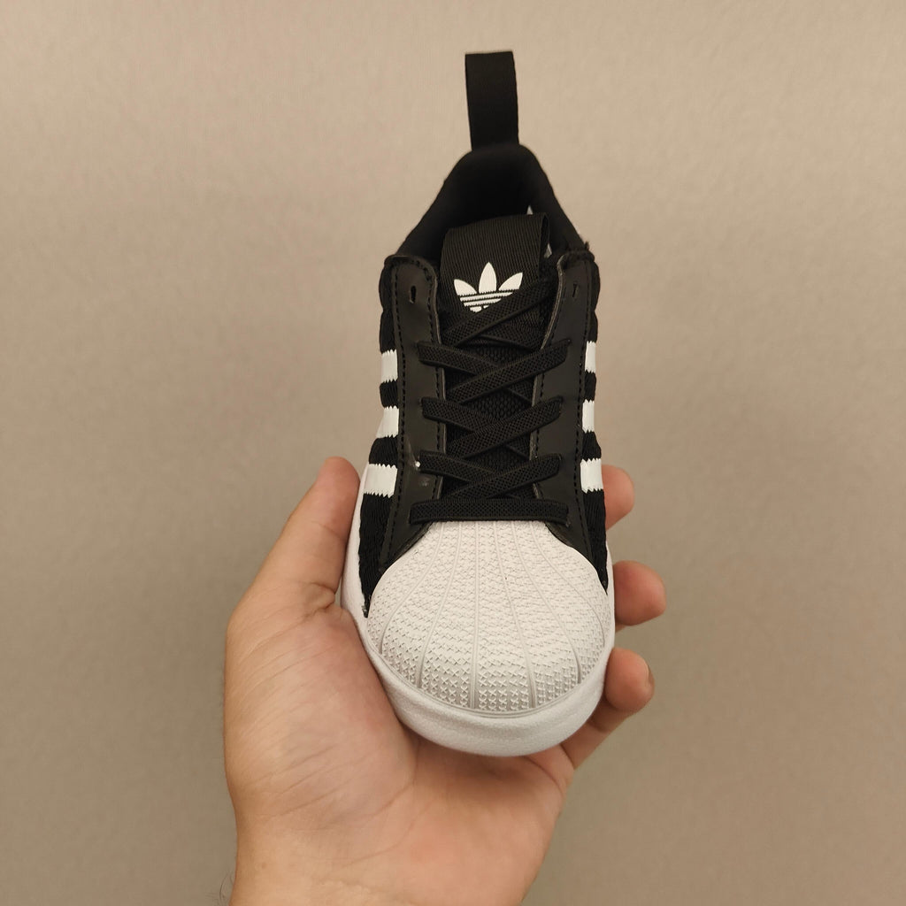 shell toe second generation" Black, white, with line"