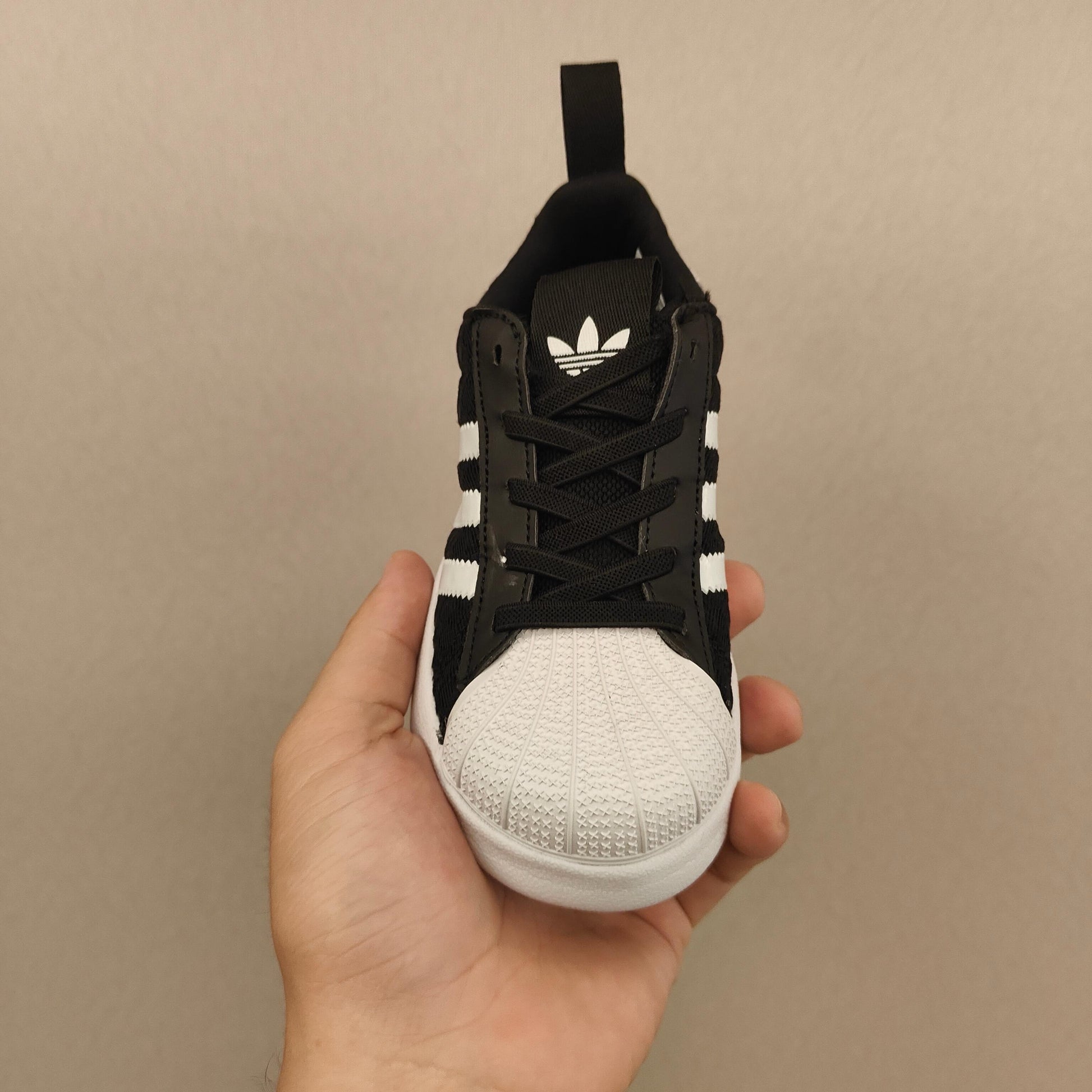 shell toe second generation" Black, white, with line"