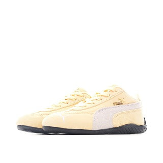 Puma racing shoes 🏎️🏎️🏎️🏎️🏎️" A light, peachy orange"