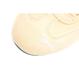 Puma racing shoes 🏎️🏎️🏎️🏎️🏎️" A light, peachy orange"