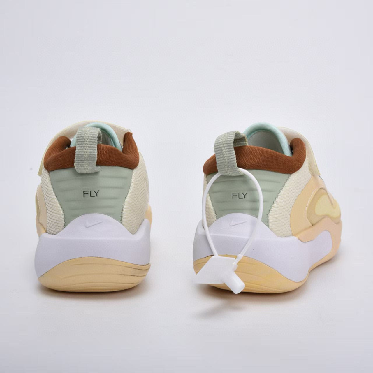 Nike basketball shoes " off white, brown, light blue, black, & white"