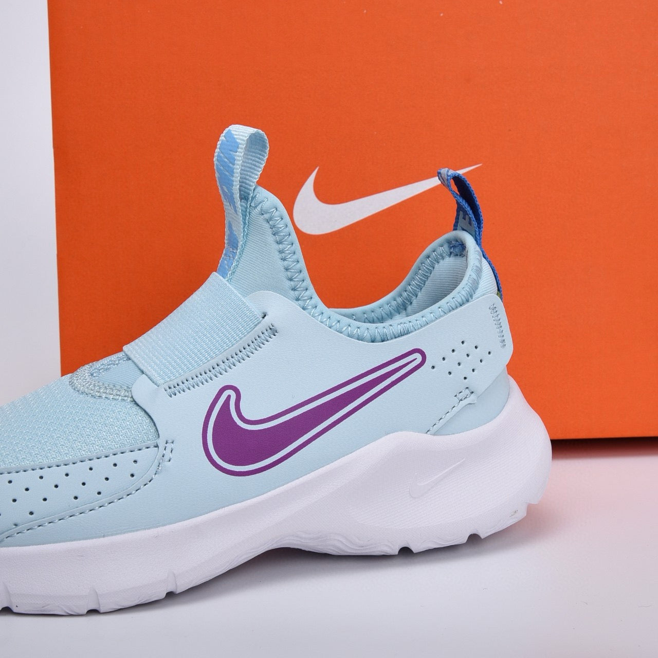 Nike slip-on running shoes" sky blue, purple"