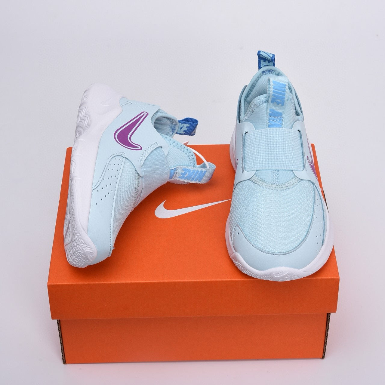 Nike slip-on running shoes" sky blue, purple"