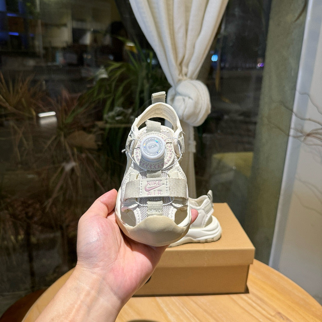 Nike closed toe rotating button sandals" light cream"