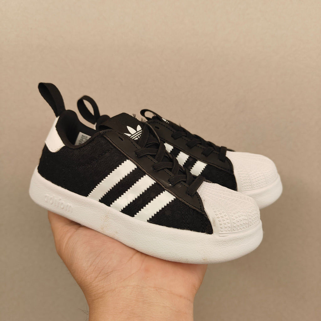 shell toe second generation" Black, white, with line"