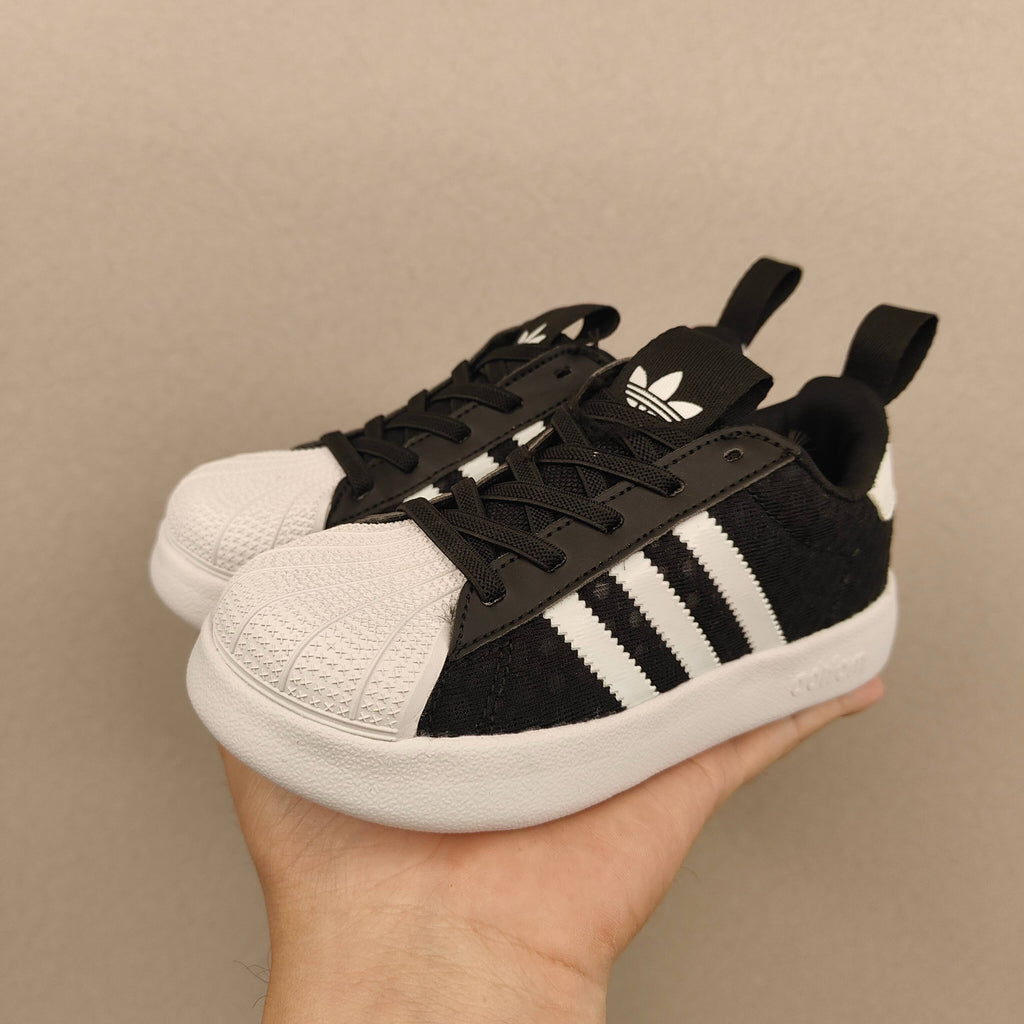 shell toe second generation" Black, white, with line"