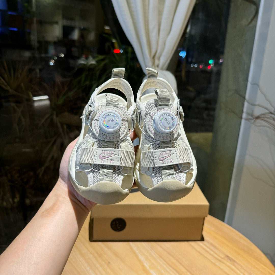 Nike closed toe rotating button sandals" light cream"