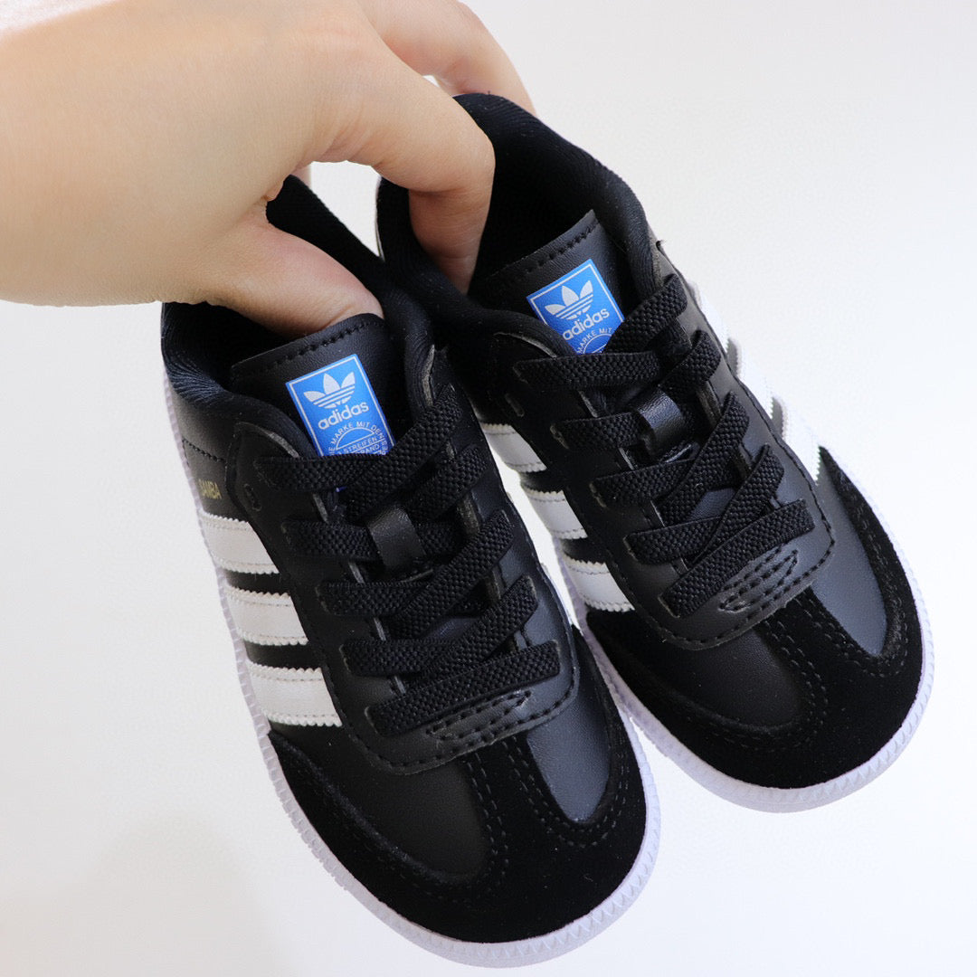 Adidas children's training shoes" black, white"
