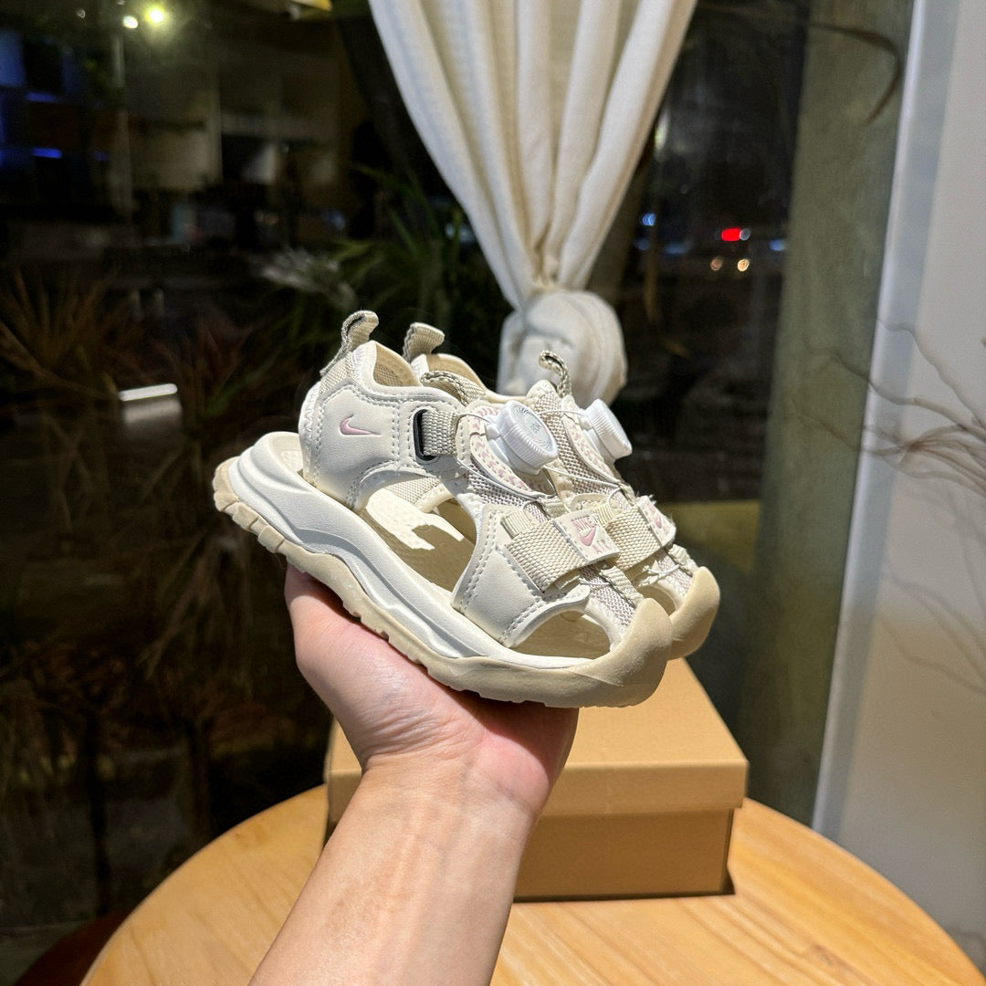 Nike closed toe rotating button sandals" light cream"