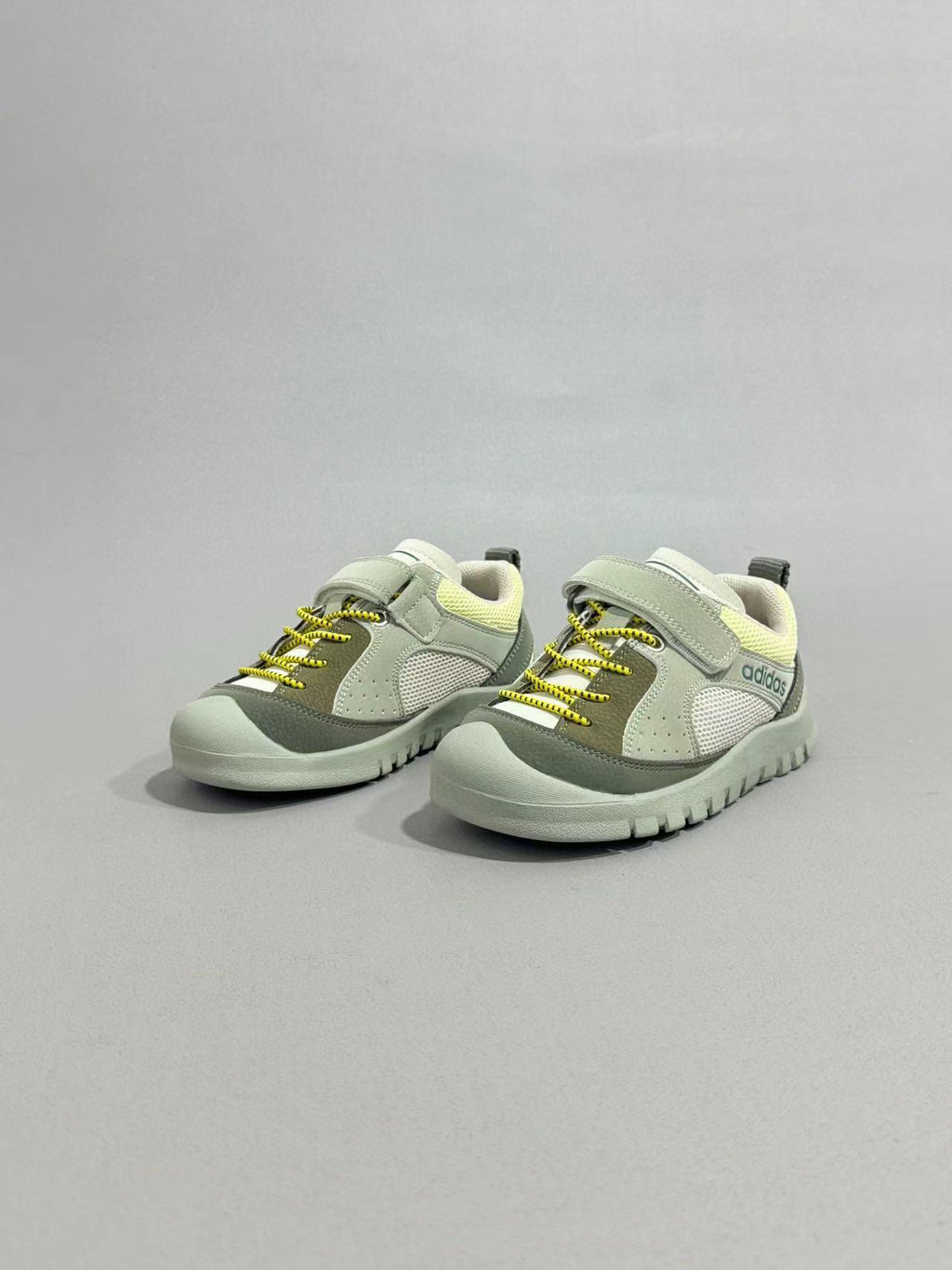 Adidas outdoor hiking shoes" muted green and grey-green.