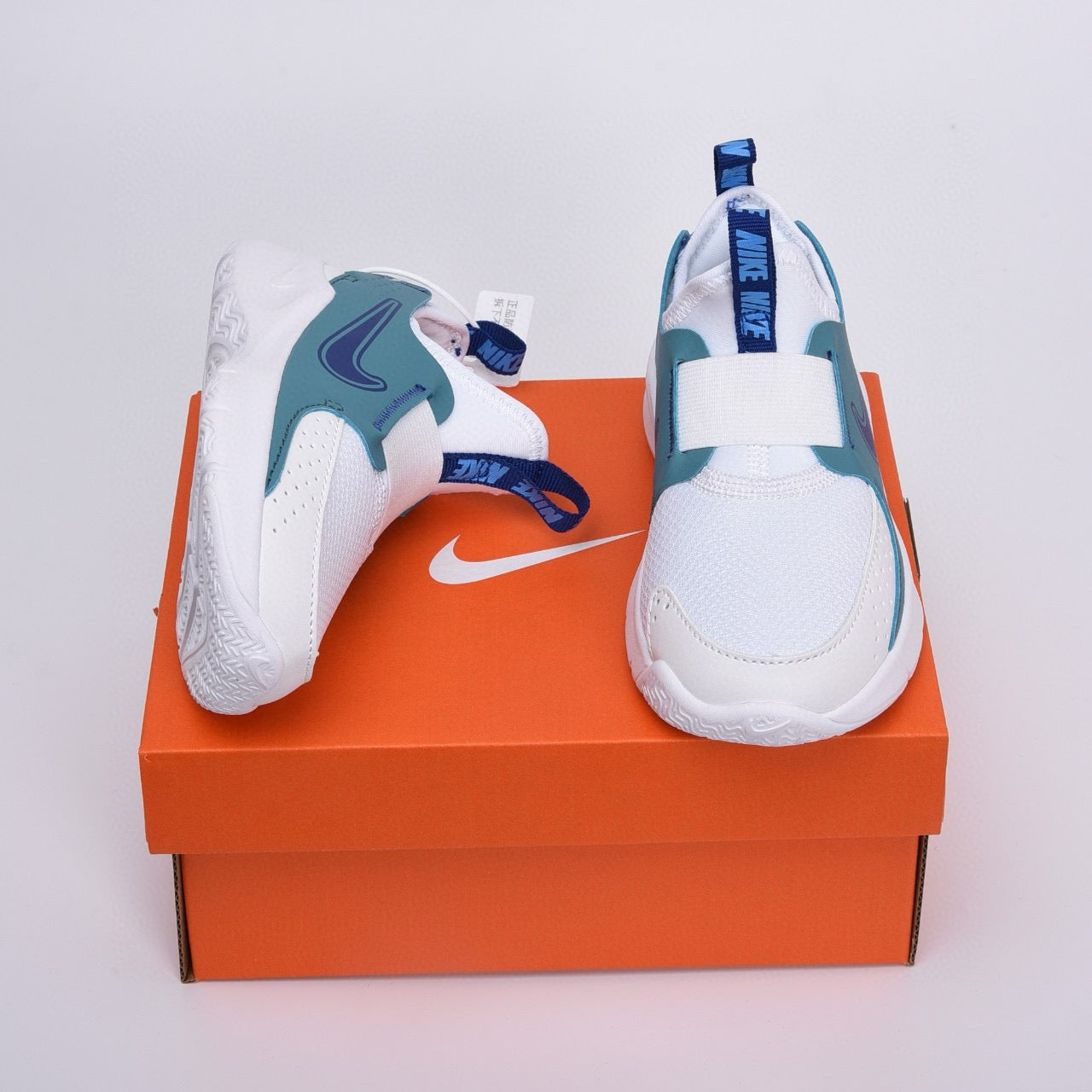 Nike slip-on running shoes"  white, greenish-blue"