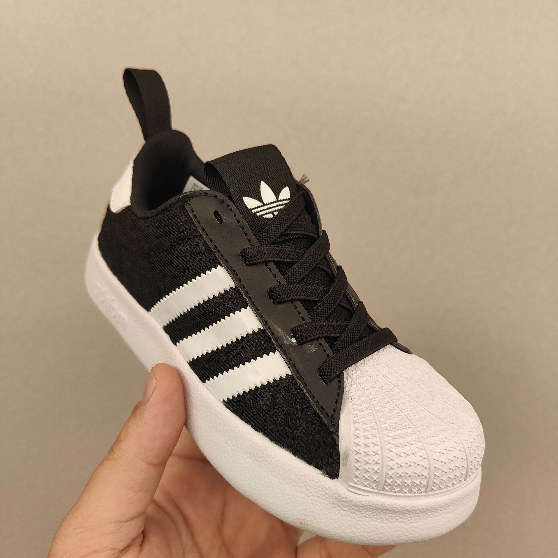 shell toe second generation" Black, white, with line"