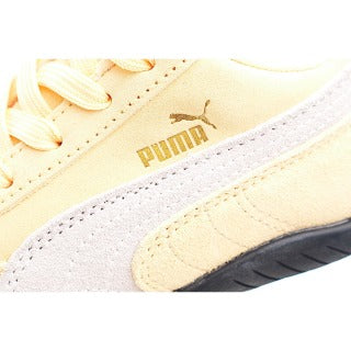 Puma racing shoes 🏎️🏎️🏎️🏎️🏎️" A light, peachy orange"