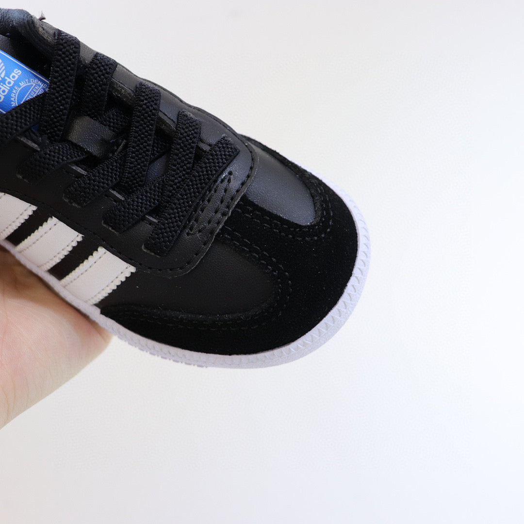 Adidas children's training shoes" black, white"