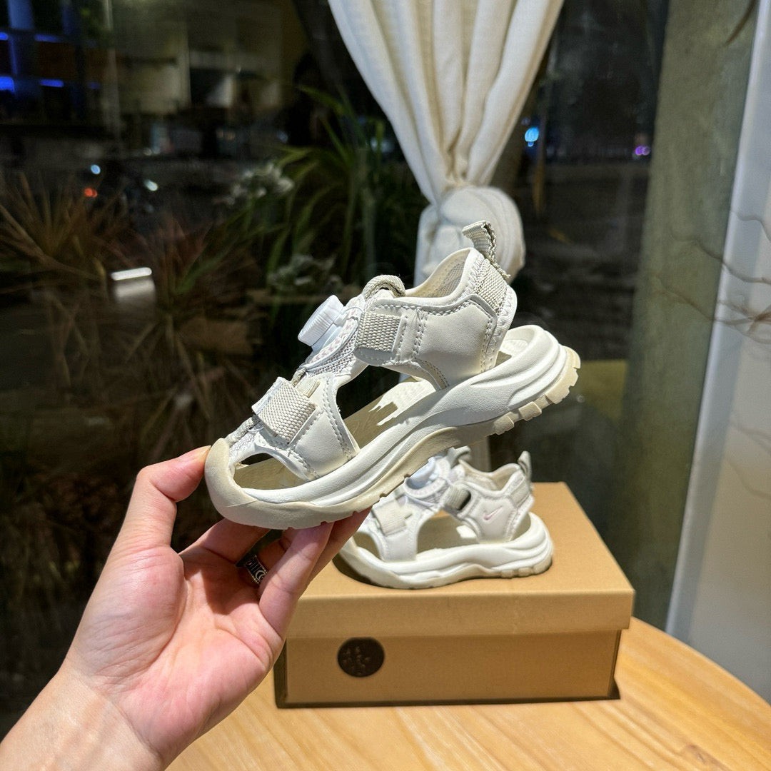 Nike closed toe rotating button sandals" light cream"