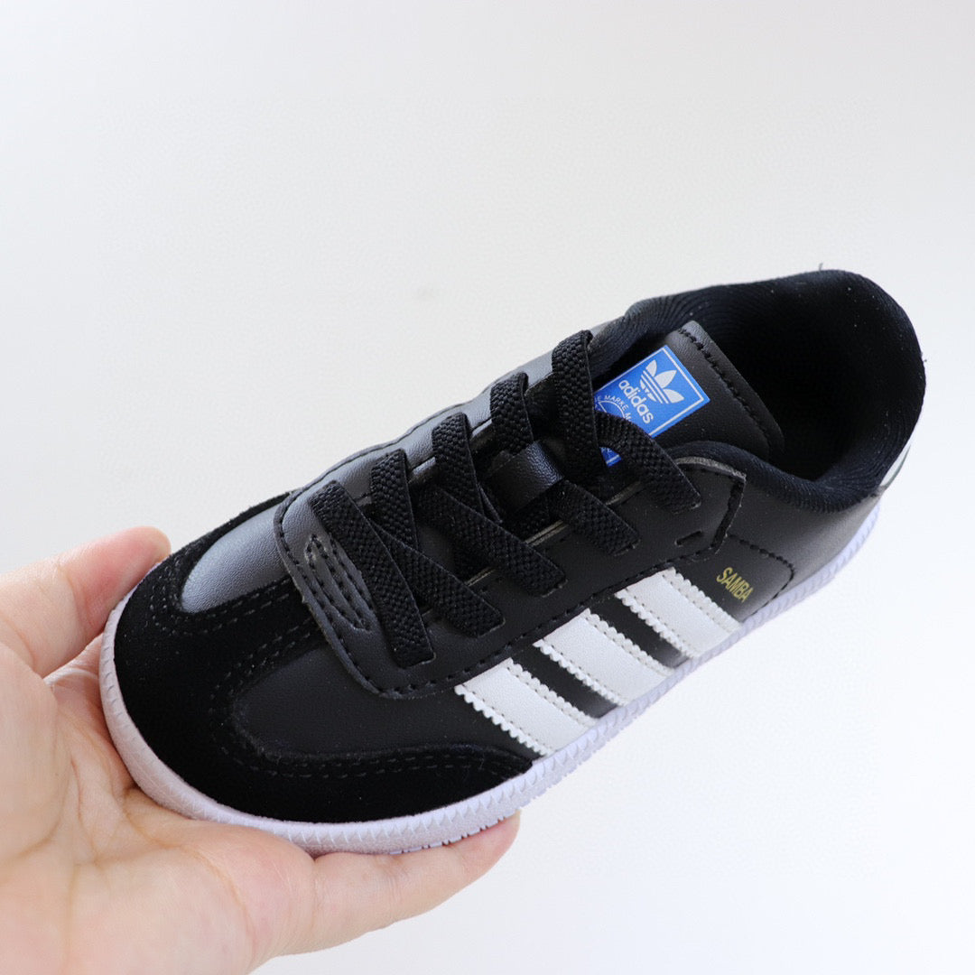 Adidas children's training shoes" black, white"