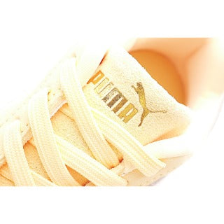 Puma racing shoes 🏎️🏎️🏎️🏎️🏎️" A light, peachy orange"