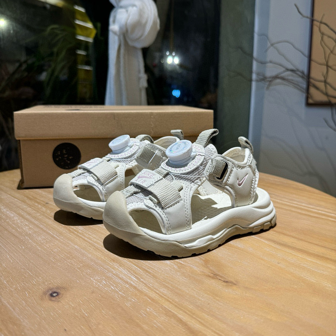 Nike closed toe rotating button sandals" light cream"