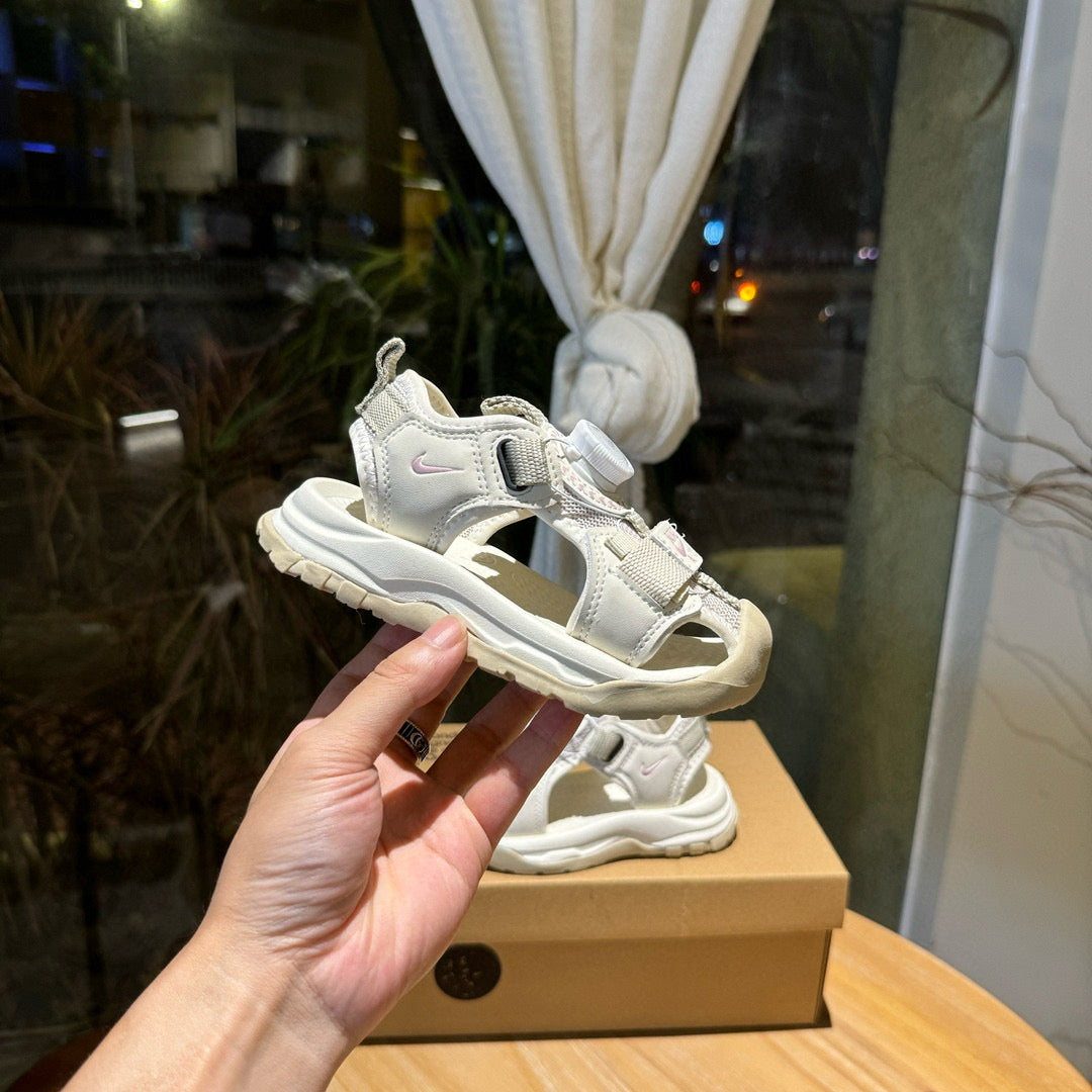 Nike closed toe rotating button sandals" light cream"